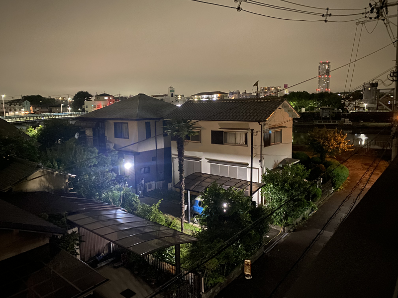 Skyline view of Aikawa neighborhood at night. 