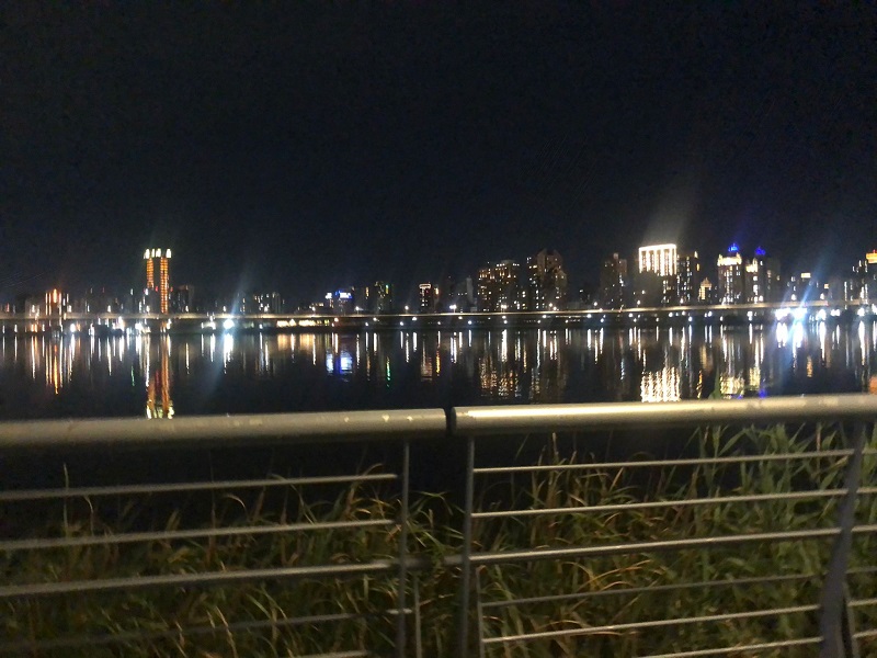 River at night with city skyline in the background 