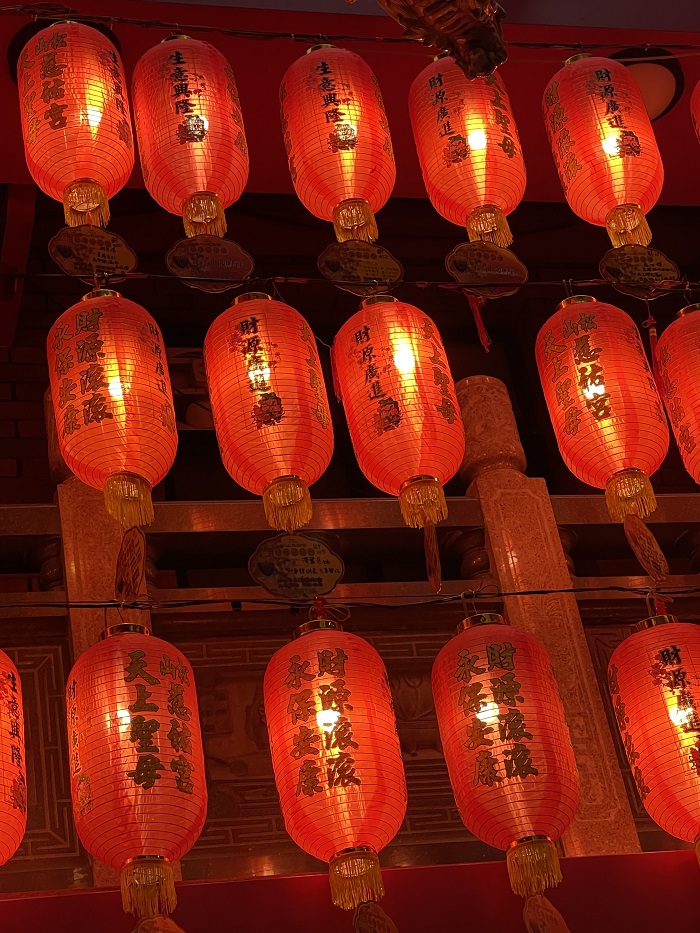 red lanterns hanging from above 
