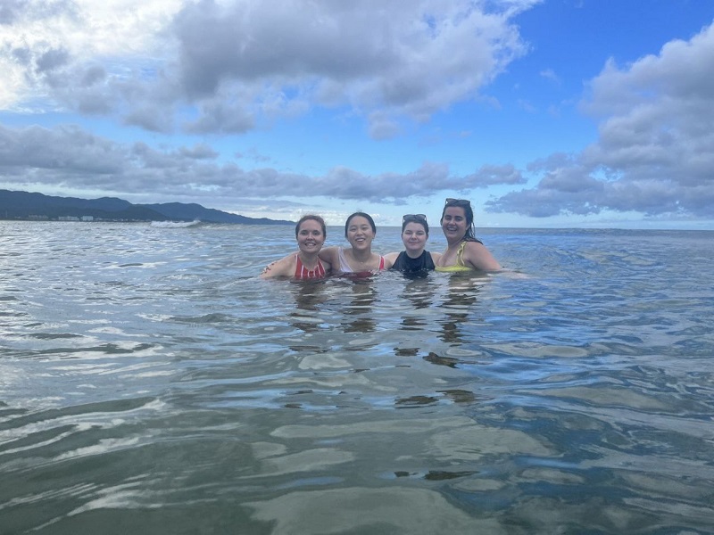 Four roommates in the ocean