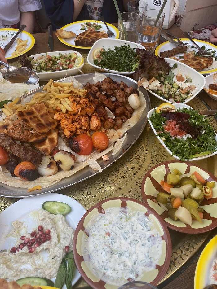 Table with a variety of Jordanian food dishes 