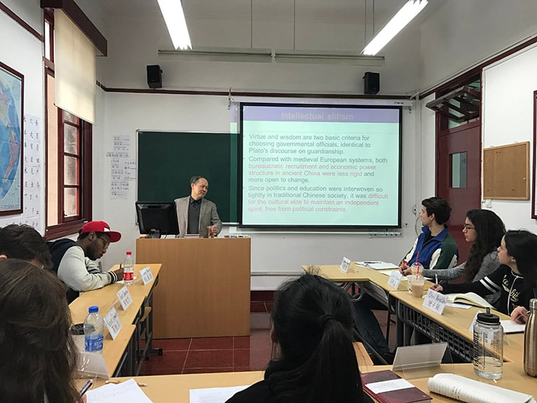 Faculty member lectures in a history class at CET Shanghai