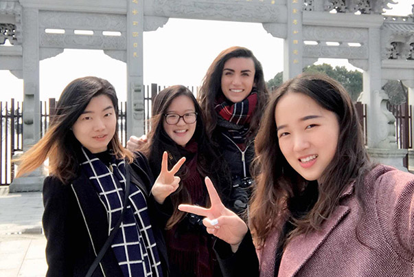 Group of female CET Shanghai students and local Chinese roommates at a temple in China