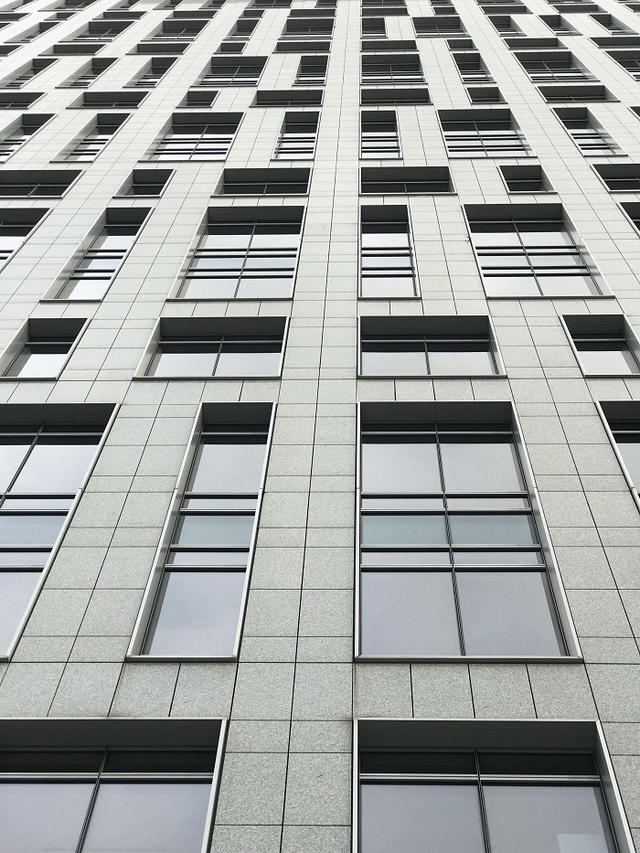 asymmetrical window pattern on side of a building