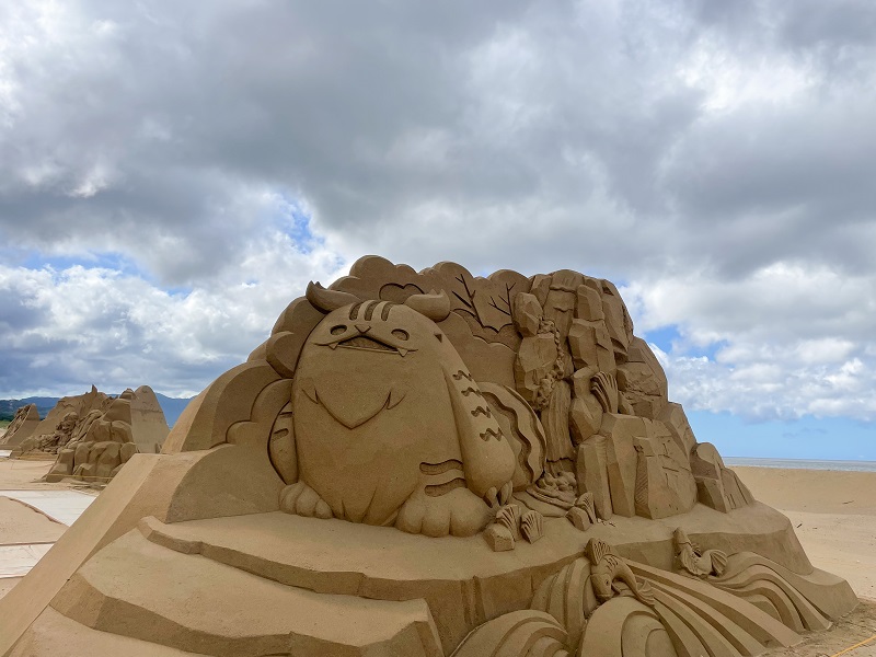 a giant sandcastle of cartoon character