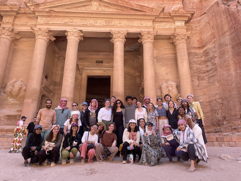 Big group of CET Students posing in front of the treasury in Petra