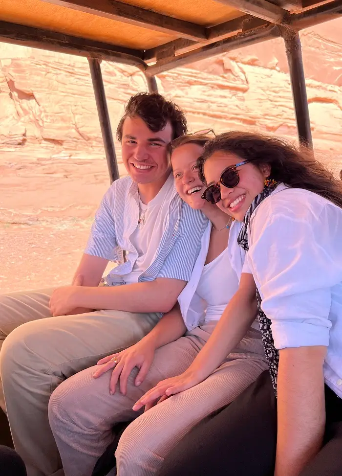 Meg and two friends sitting in truck