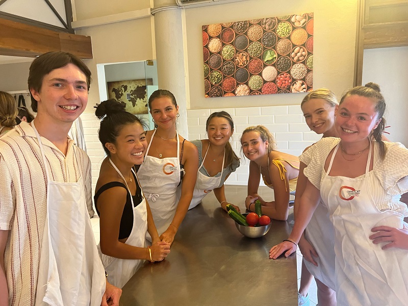 CET Students in aprons at a cooking class