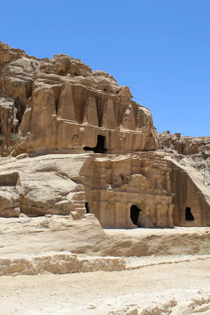 large rock formation with caves 