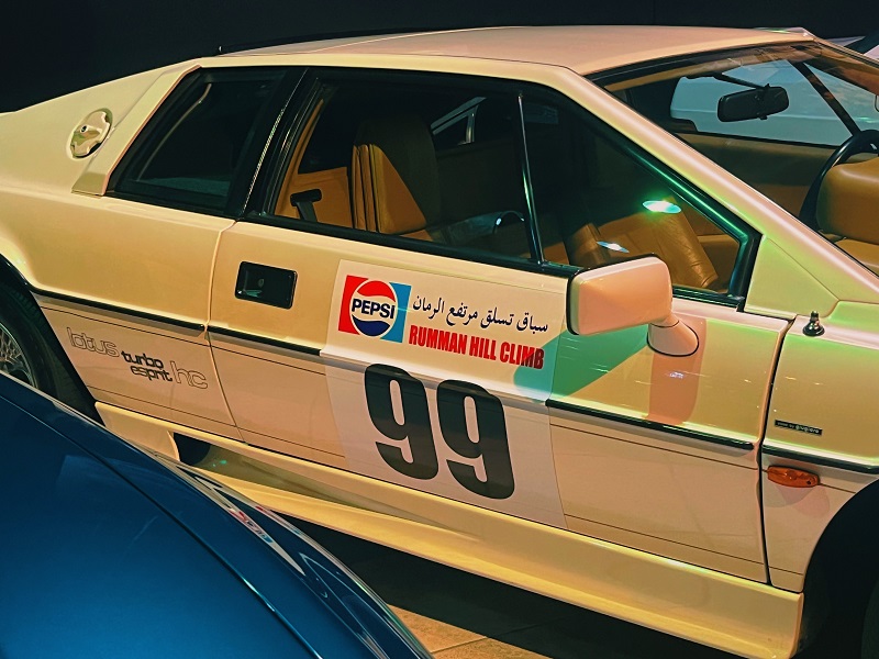 white/yellow sports car with "99" and pepsi logo