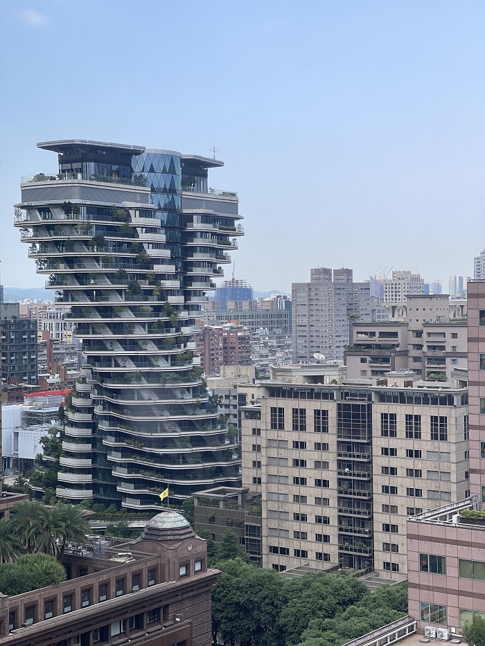 Double helix shaped building amongst skyline