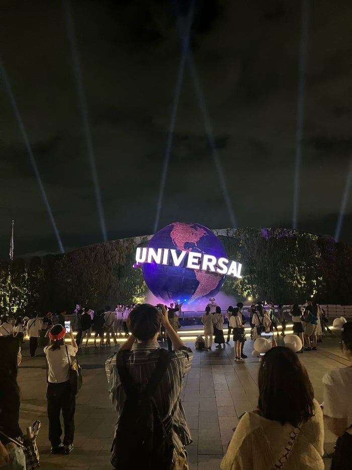 Universal studios sign lit up at night