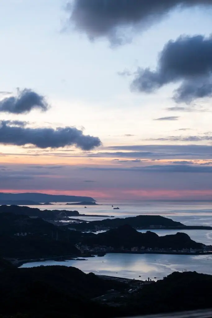 View over looking sea shore at sunset