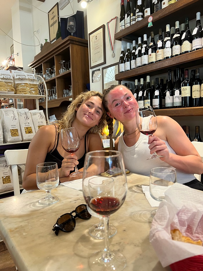 two friends at a wine tasting 