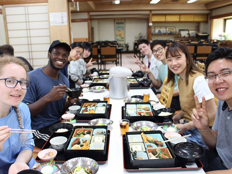 CET Japan study abroad students and local roommates enjoy lunch in a restaurant