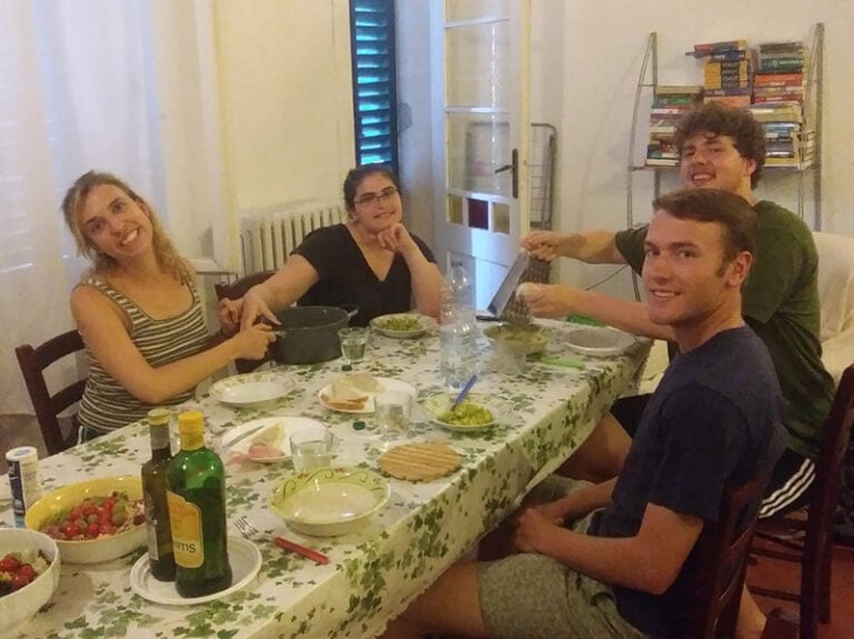 CET Siena study abroad students enjoy a meal in their apartment