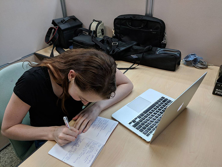CET Taiwan study abroad student studies with a laptop and notebook