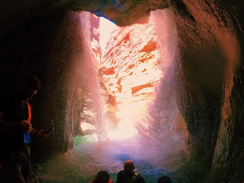 Water falling down under the rock formation