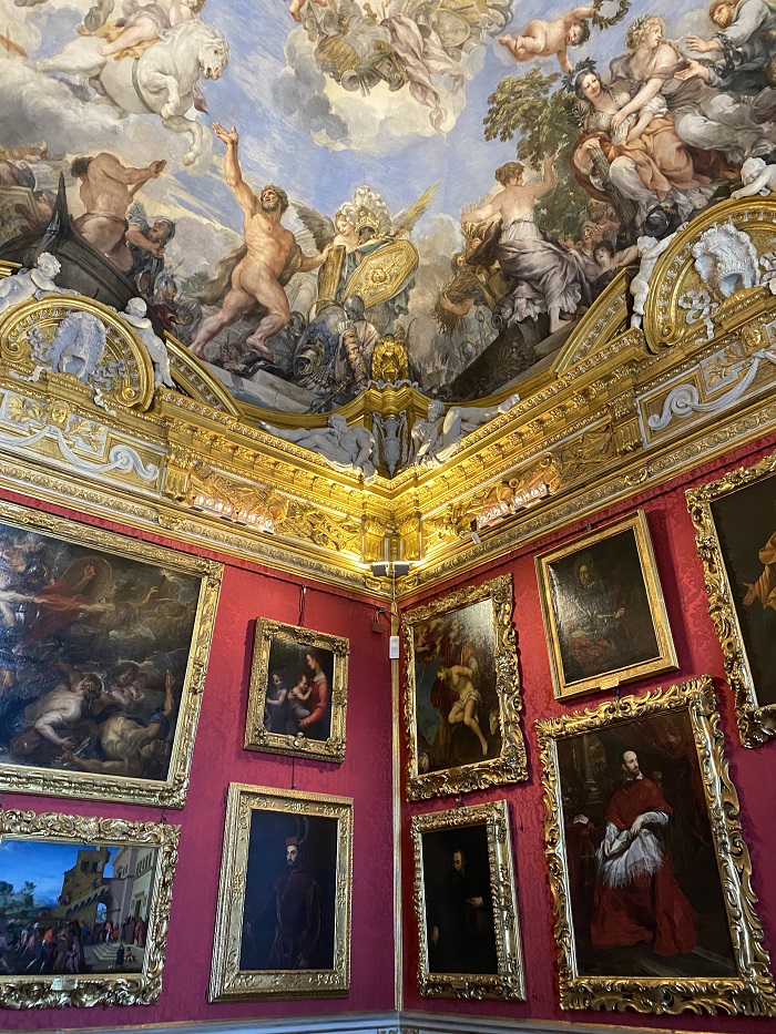 portrait wall with art on the ceiling