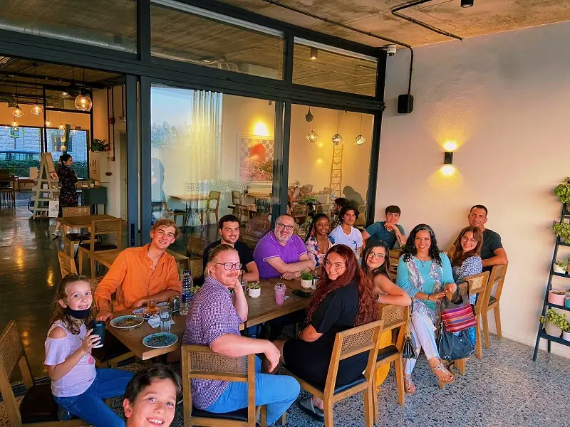 Group of people sitting around the table