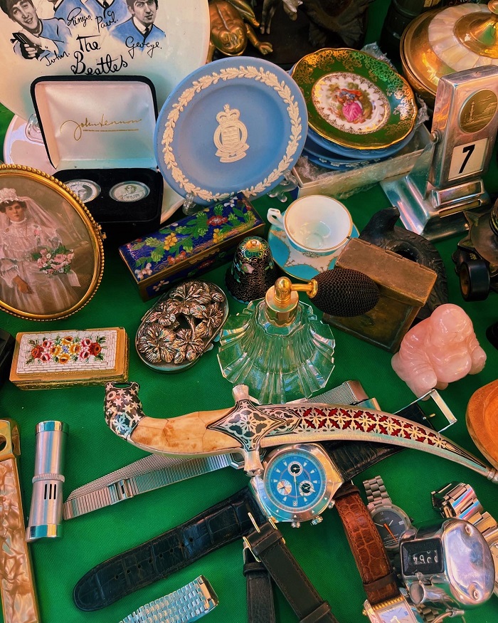 Variety of trinkets on a green table