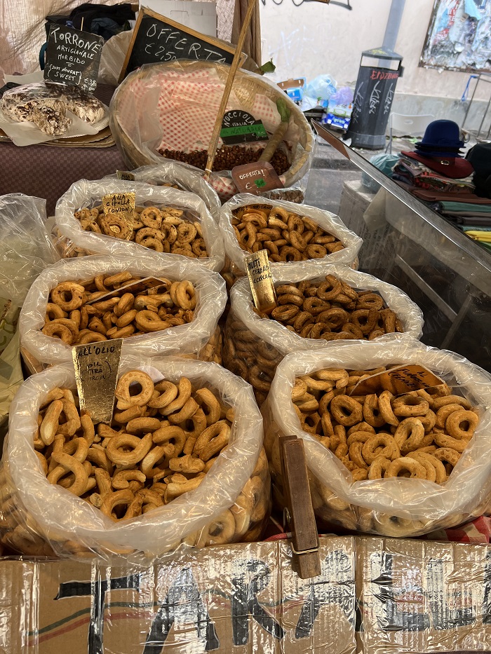 Six sacks of fresh taralli in a variety of flavors, as seen in Sant'Ambrogio market.