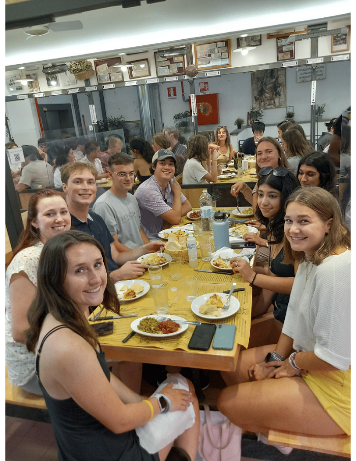 Nine students dining together 