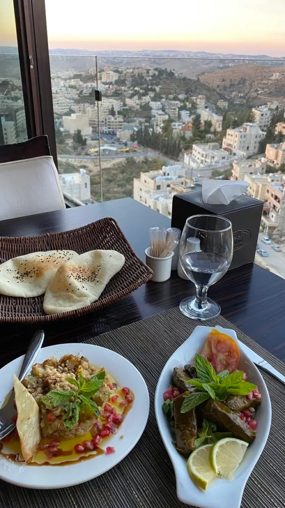 Baba ghanouj and grape leaves at a restaurant called Qamar Lebnan in Jordan