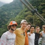 Six students posing on a suspension bridge in Taroko Gorge