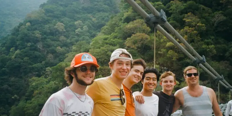 Six students posing on a suspension bridge in Taroko Gorge