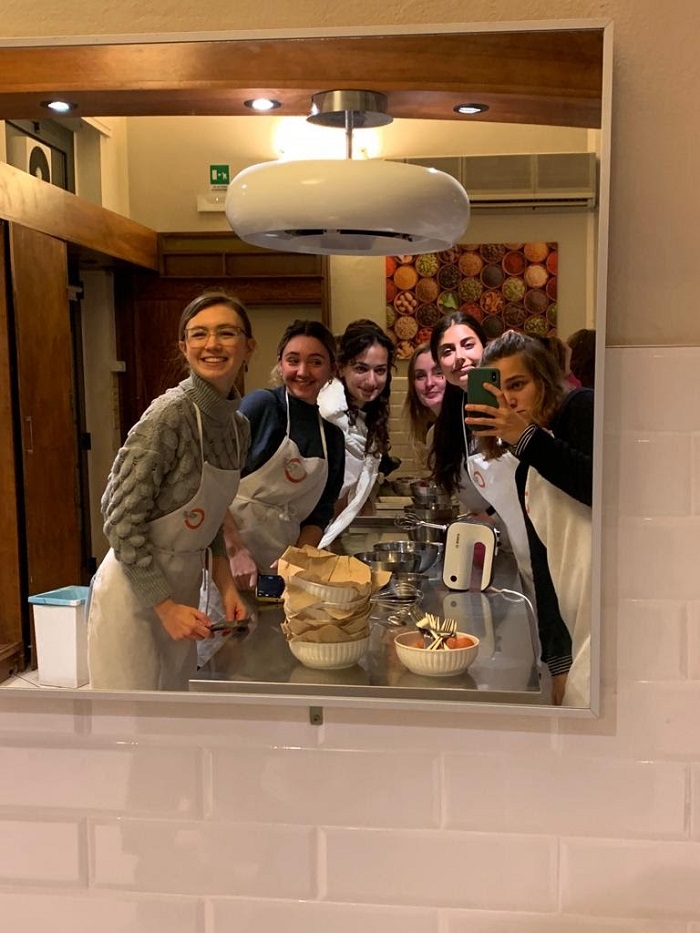 Students taking a mirror selfie in a cooking class
