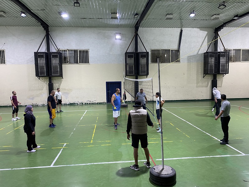 An indoor volleyball game with Jordanians and foreigners