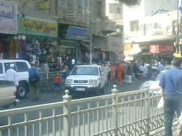 Cars and people in a street in Jordan