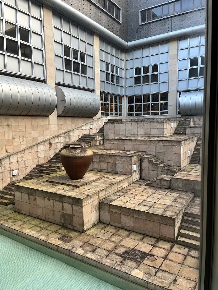 An exhibit with a vase and geometric steps inside the National Museum of Ethnology