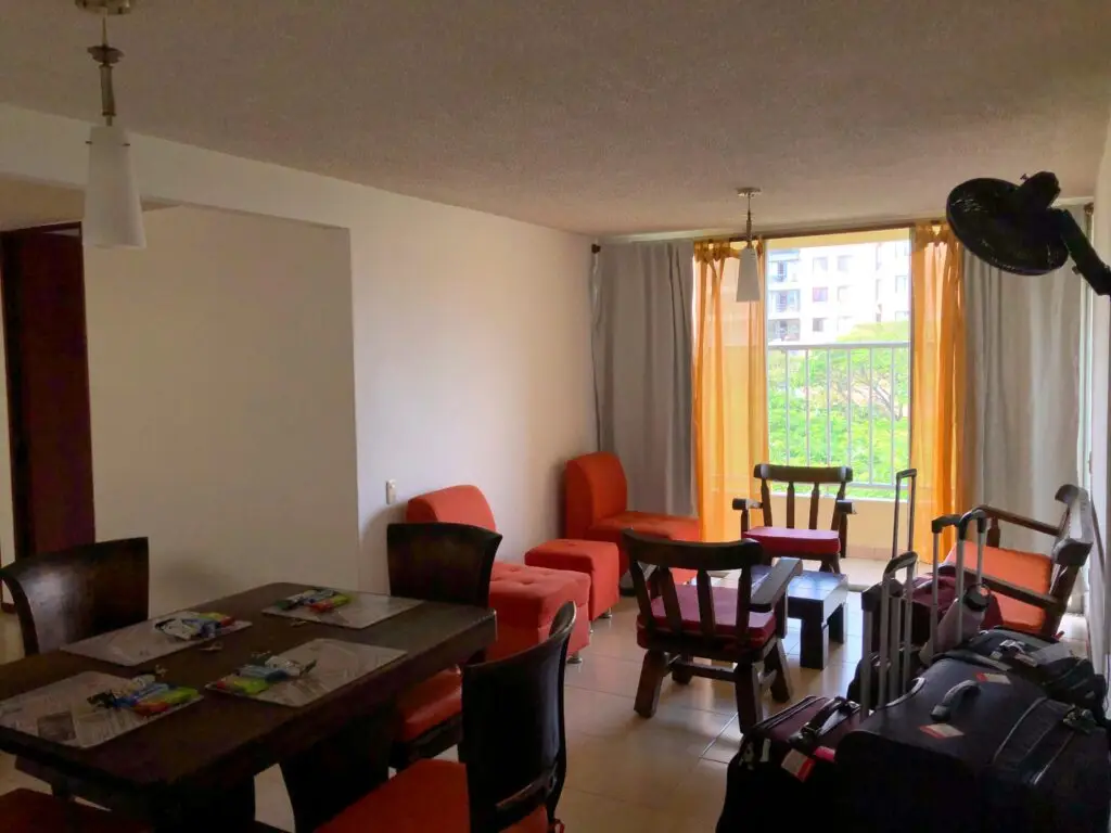 Living space for CET Colombia students with a dining table, chairs, and more