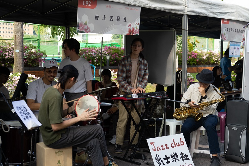 People playing instruments in the National Taiwan University club fair 