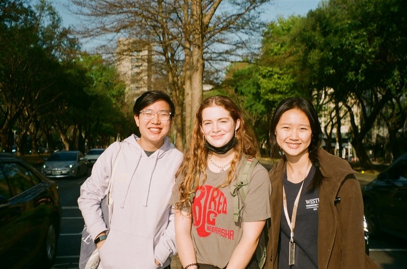 Three CET Taiwan students smiling outdoors in Taipei, Taiwan