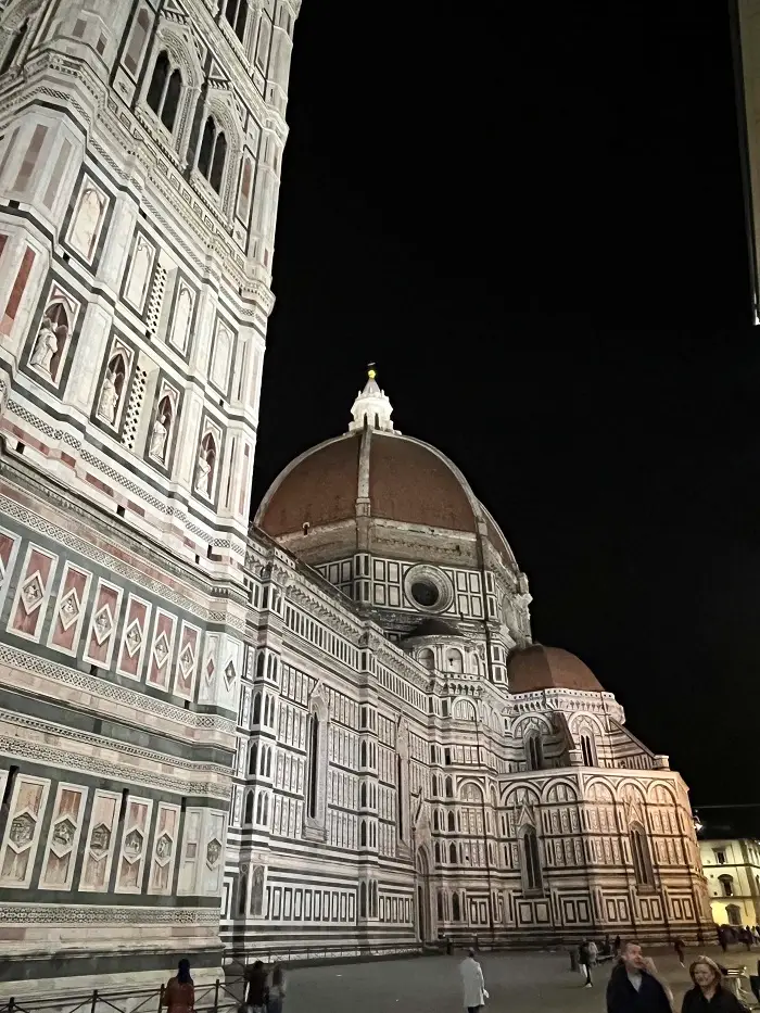 The exterior of the Duomo building in Florence, Italy at night