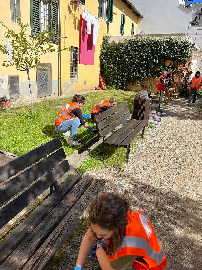 Some CET Florence students volunteering and painting benches