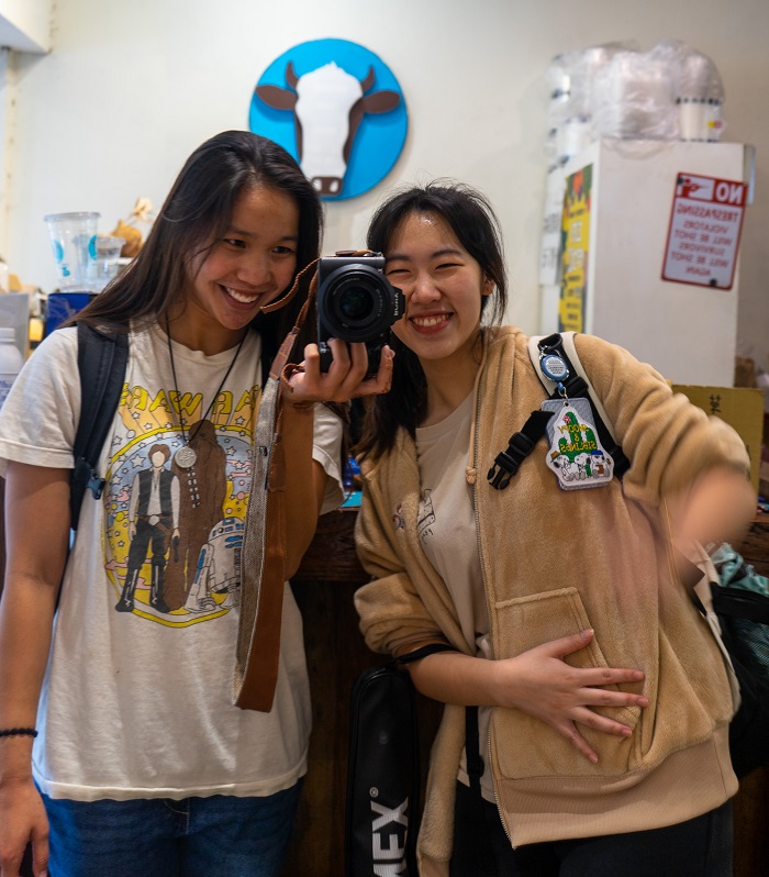 A CET Taiwan student and her language partner posing and smiling in front of a mirror