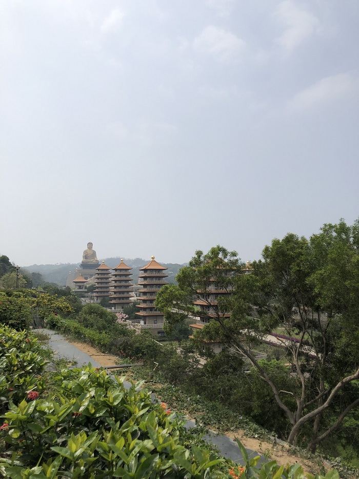 View of the Fo Guang Shan monastery with many pagodas in the distance among trees 