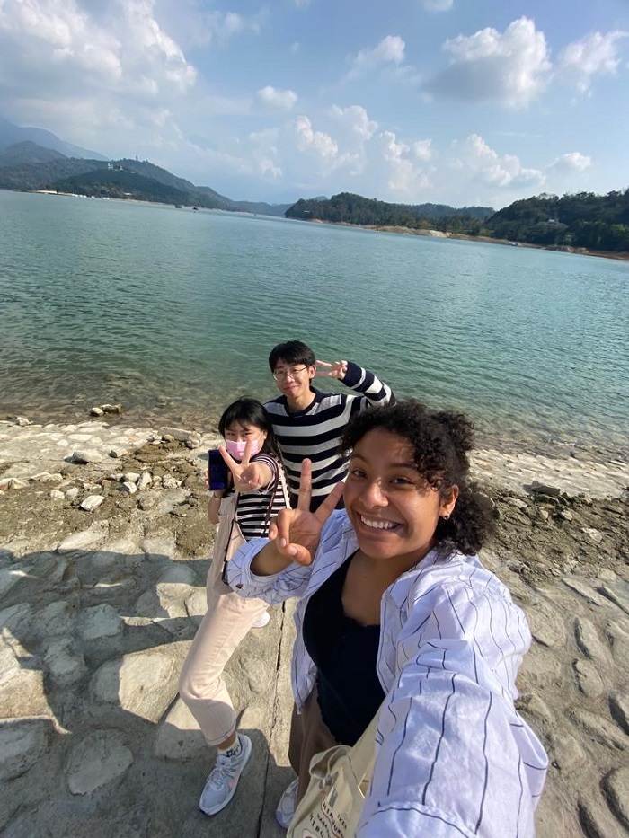 A CET Taiwan student and her language partner's family by the Sun Moon Lake