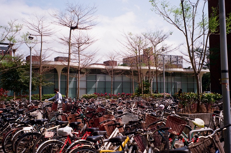 Many bikes parked outside of the Chinese Language Division building on National Taiwan University's campus