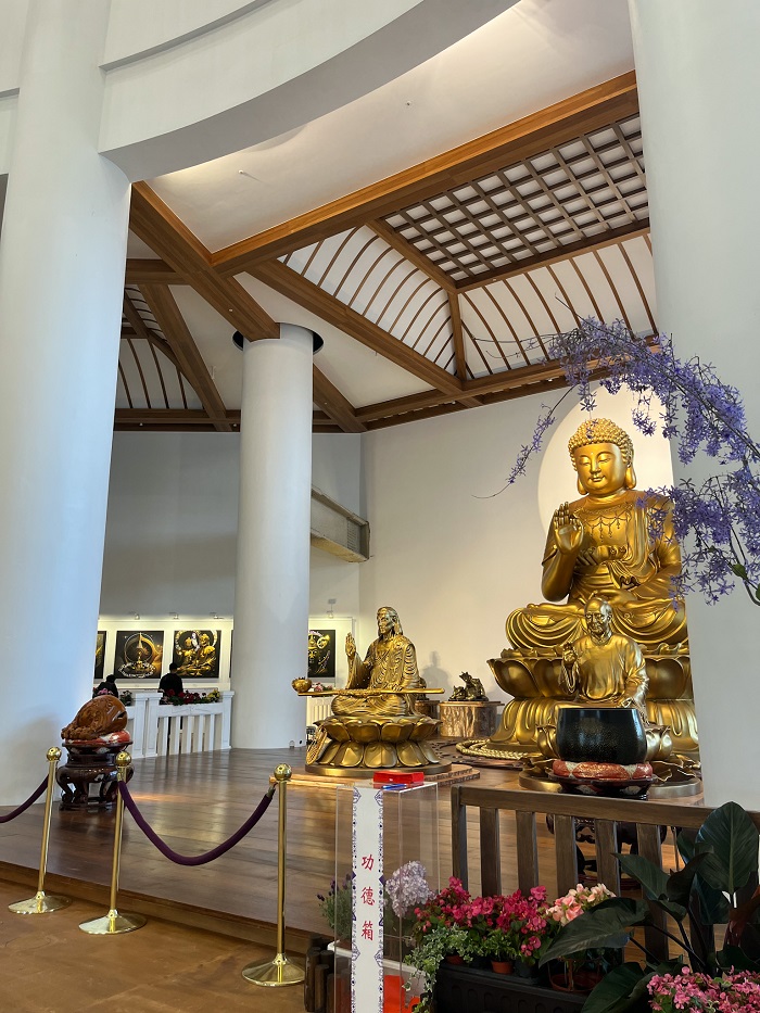 Multiple golden statues of an Guanyin collection within the Yuan-Dao Guanyin Temple in Tamsui
