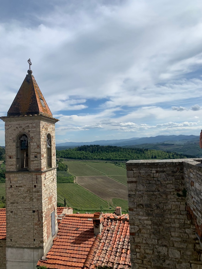 Views of green mountainous ranges from the top of a castle in the Tuscan hills