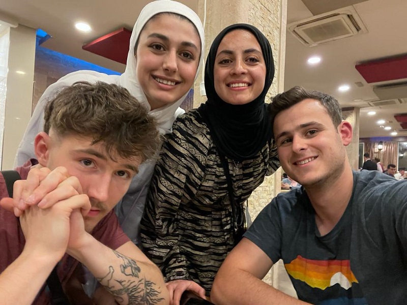 Two CET Jordan students and their two female Jordanian neighbors smiling together