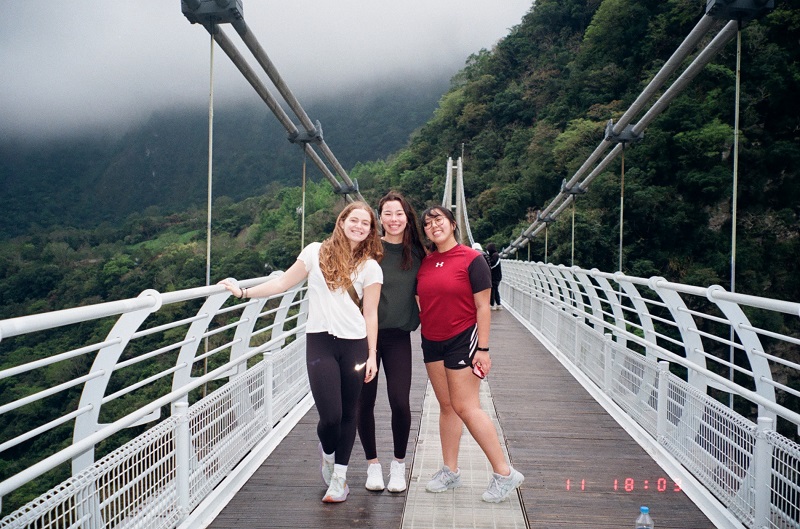 A group of three females from the CET Taiwan program standing in the middle of Buluowan Terrace in Taiwan
