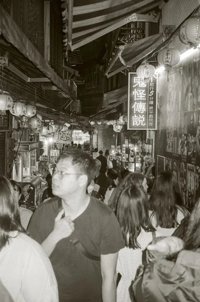 Jiufen Old Street full of people, tea shops, restaurants, souvenir shops, and more