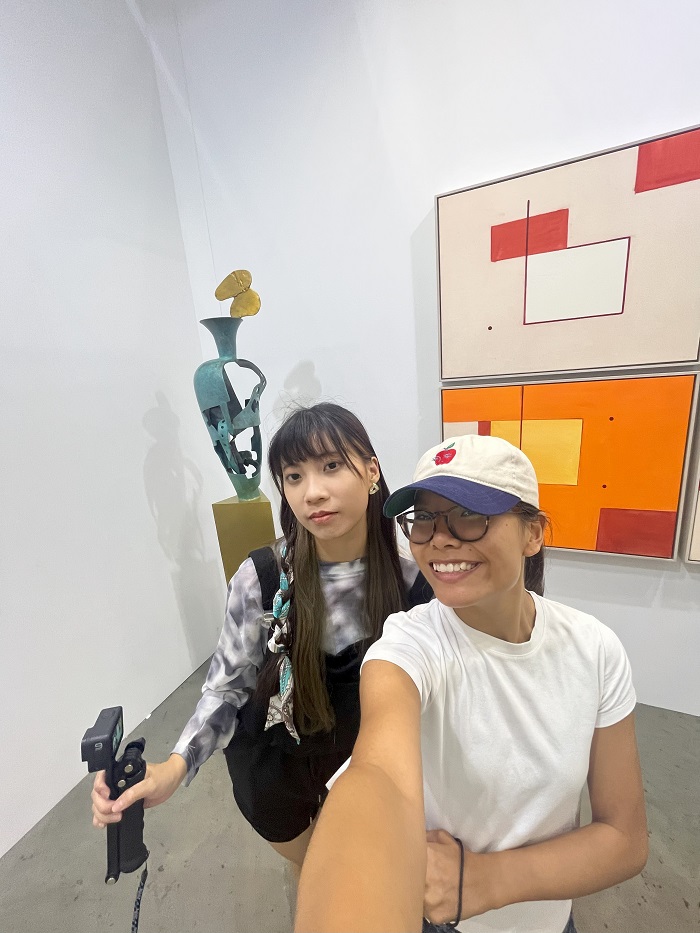 A CET Taiwan student with her language partner in an exhibit at the Taipei Global Art Festival