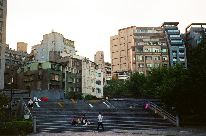 People walking and sitting in the Nishi Honganji Square